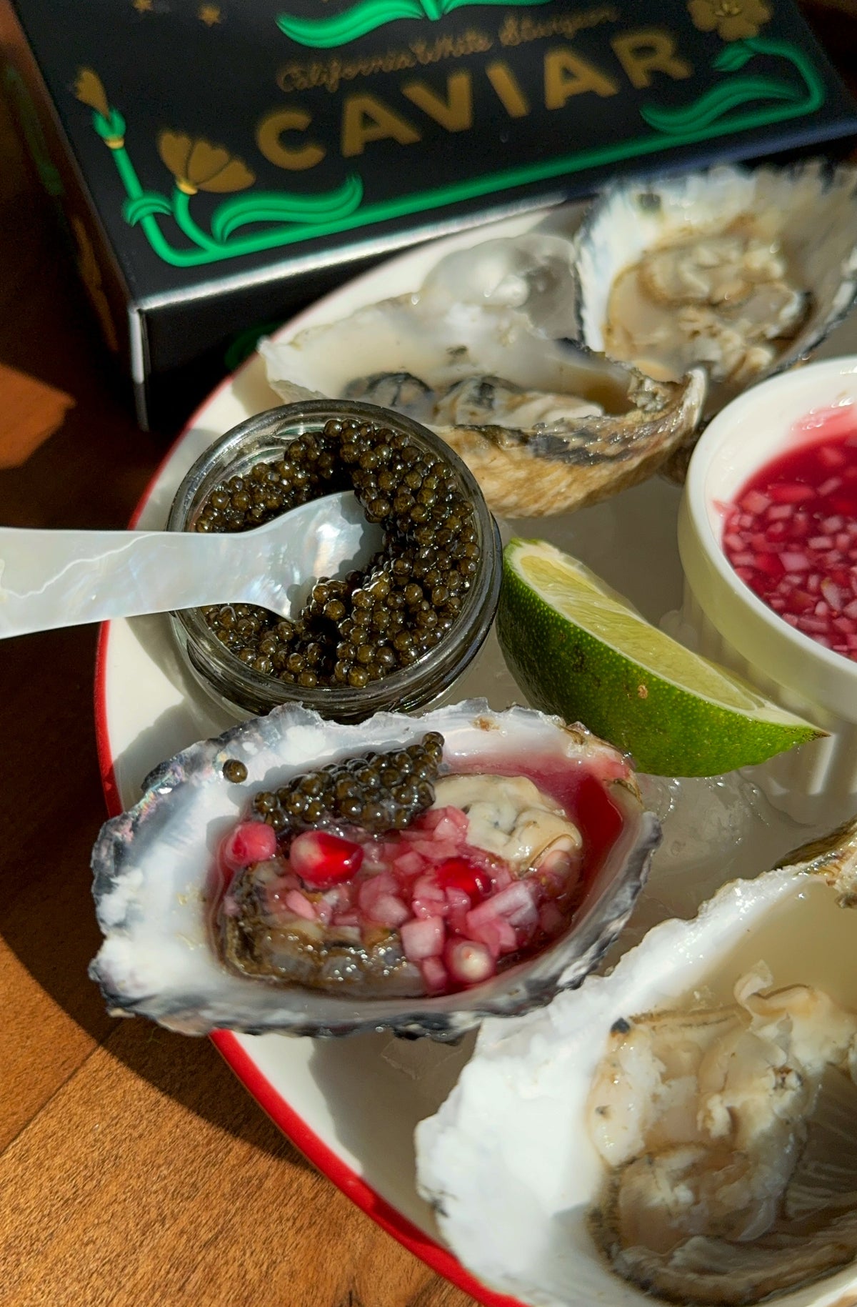 Oysters on the Half Shell with Pomegranate-Lime Mignonette and Caviar